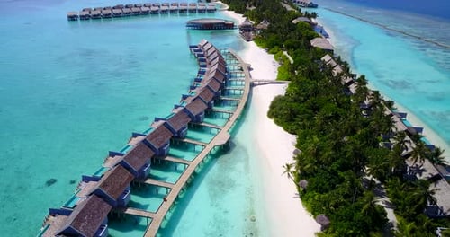 Tropical overhead island view of a paradise sunny white sand beach and aqua turquoise water backgrou