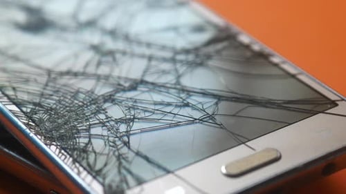 Top View of Broken Smart Phone on Color Background