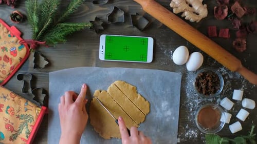 Woman Cuts Cookie Dough with Chroma Key Device