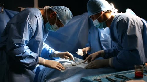 Doctors Performing Surgery in Hospital Operating Room