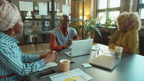 African American Manager Speaking to Team on Office Meeting