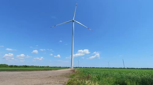 Electric windmill with long blades close-up. Wind turbine for the production of electricity.