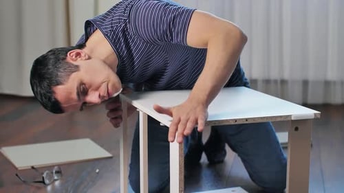 Man Assembling Furniture at Home