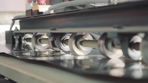 Metal Sheet Being Processed by Industrial Machine
