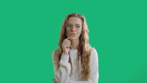 Woman Ponders Against Green Screen Background