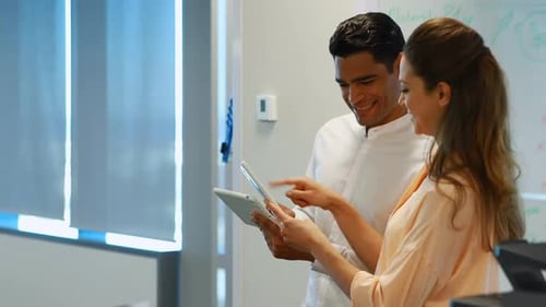 Colleagues Using Tablet for Project Collaboration