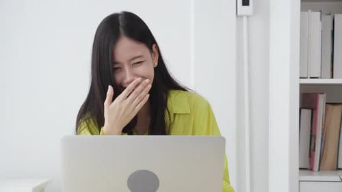Woman Waving During a Video Conference Call
