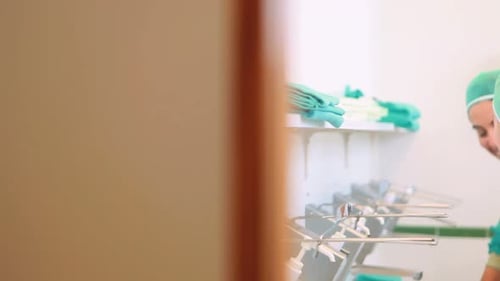 Close up of surgeons brushing hands