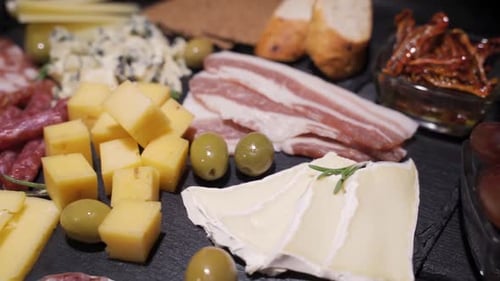 Platter with Spanish Ham Jamon Serrano or Italian Prosciutto Crudo, Sliced Italian Hard Cheese