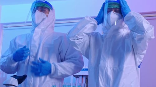 Scientists Wearing PPE in a Laboratory Setting