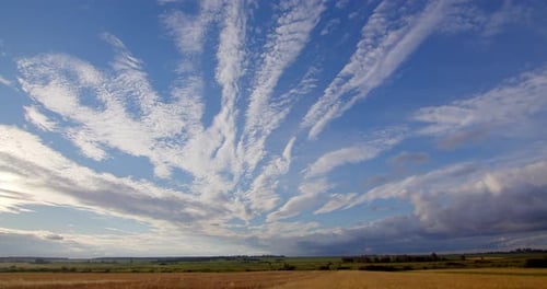 Amazing White Clouds Over the Field