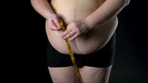 Overweight Man Measuring Belly With Tape, Weight Loss, Unhealthy Nutrition