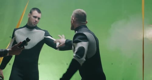 Film Crew Preparing Actor on Green Screen Set