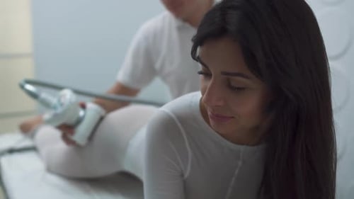 Woman Receiving Aesthetic Massage Treatment at Clinic