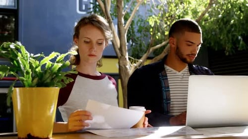 Executives working together in cafeteria 4k