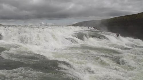 Cascade Fast Mountain River With Clean Fresh Water Flows Over Rocks Waterfall Stream In Iceland
