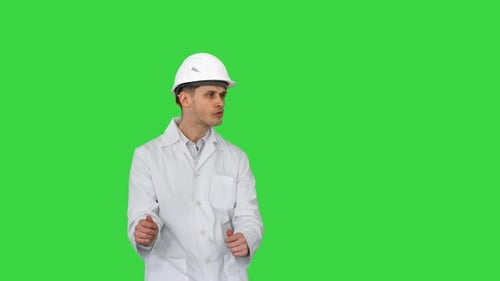 Engineer Man Dancing in Funny Way on a Green Screen, Chroma Key.