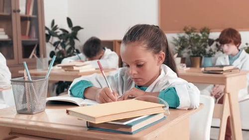 Children Learning and Writing in a Classroom