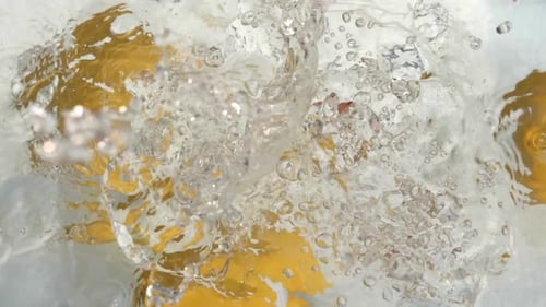 Lemons Splashing into Water, Close Up