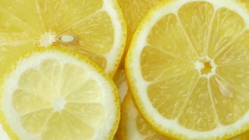 Rotation of a juicy yellow lemon. Top view, 360 degree rotation, close-up of a lemon in a cut.