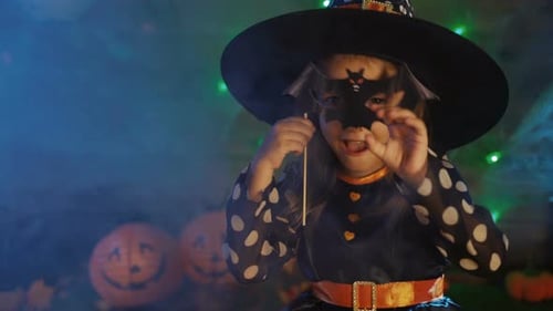 Cute Girl Dressed as a Witch at Halloween