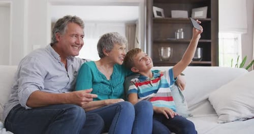 Grandparents and Grandson Taking a Selfie Together