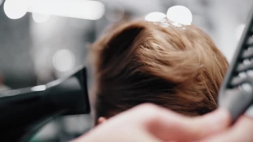 Haircut with Hair Dryer and Comb in Salon