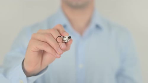 Man Writing Certified Service on Glass Surface