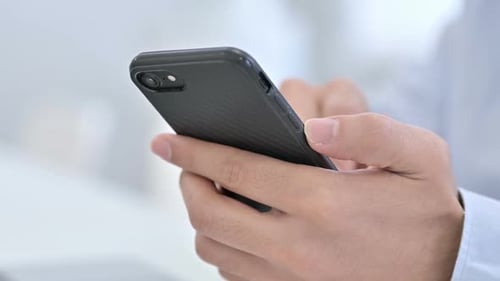 Close Up of Hand Using Smartphone, Browsing Online