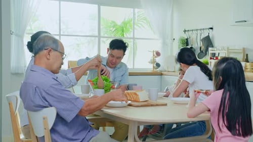 Family Enjoys Mealtime Together in Kitchen