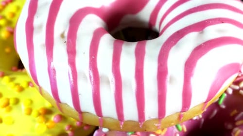 Close Up of Colorful Iced Donuts