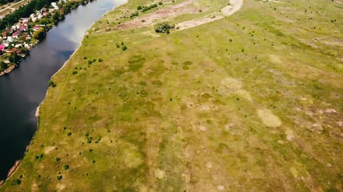 Flight Over the Field and the River, Near a Small Village, Summer Day. Beautiful Landscape