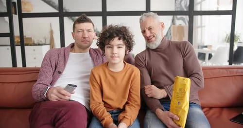 Family Watch Scary Movie Together on Couch