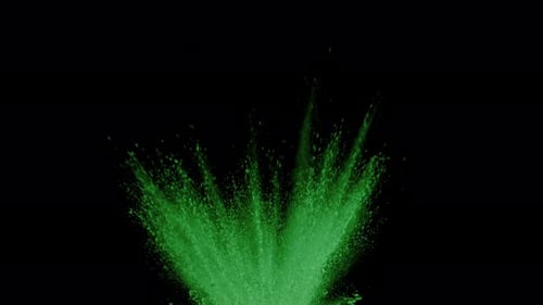 Green powder exploding on black background in super slow motion, shot with Phantom Flex 4K