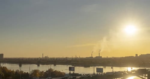 Timelapse of City Life. Sun Rays, Blue Sky, River and Bridge Over Horizont. Traffic Jam at Summer