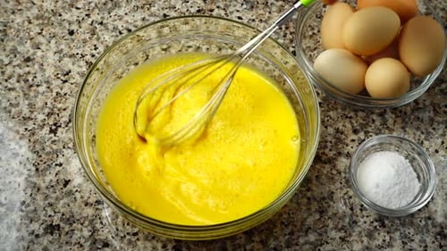 Milk Being Added to Whisked Eggs