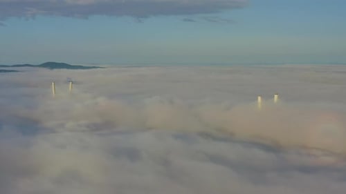 Tops of the Pylons of the Golden Bridge in the Dawn Fog in Vladivostok