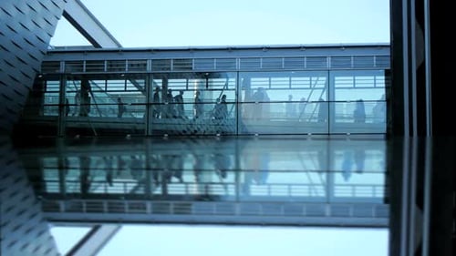 Group of Business People Walking Through Modern Glass Hall way in Financial District