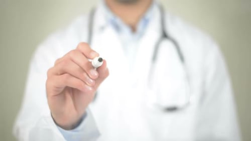 Melanoma, Doctor Writing on Transparent Screen