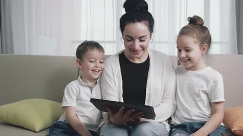 Happy Family Using a Tablet at Home