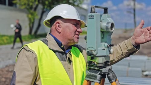 Survey engineer at construction site.