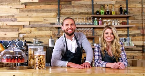 Smiling Adults at Cafe Counter