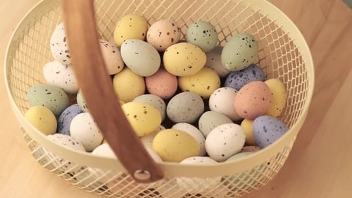 Basket Full of Pastel Speckled Easter Eggs
