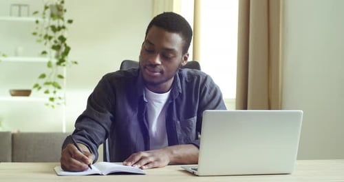 Close-up African Black Businessman Wears Casual Mixed Race Shirt Student Guy Sitting at Table in