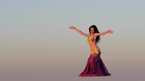 Woman Dances in Desert at Sunrise
