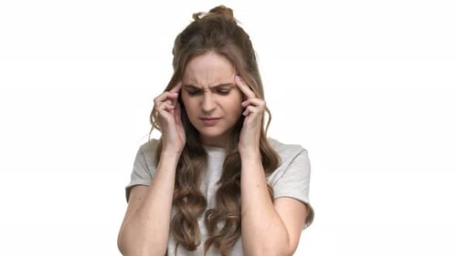 Woman Holding Head in Pain on White Background