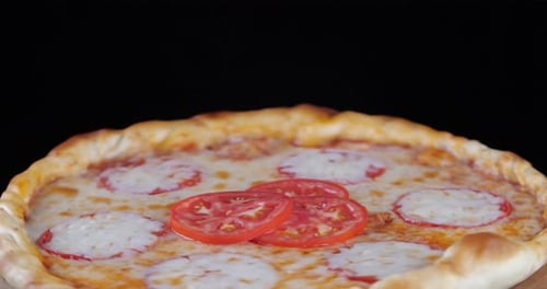 Close-up of Appetizing Neapolitan Italian Vegetarian Whole Pizza with Fresh Tomato Onion and Spices