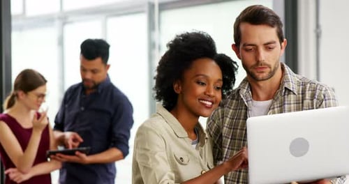 Young Adults Collaborating in a Modern Workplace