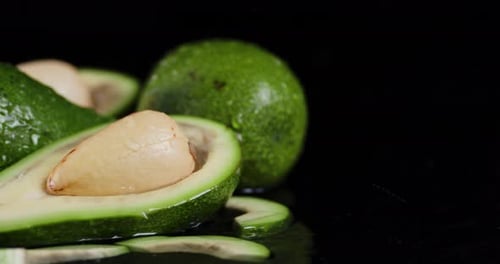Rain Drops Falling on Fresh Avocado.