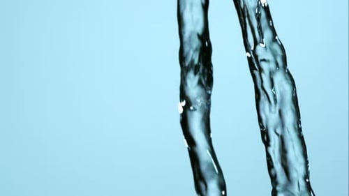 Water pouring down in abstract close up shot